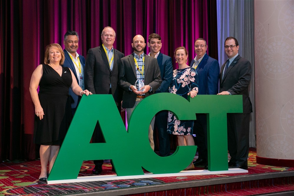 Columbia University representatives from the Transportation and Environmental Stewardship offices accept the award from ACT at the International Conference on August 7, 2019.