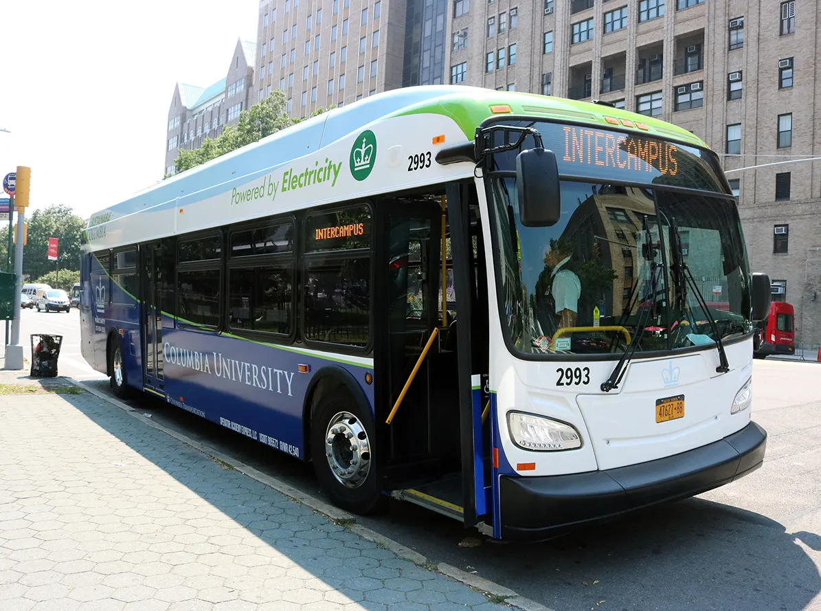 One of the new electric buses at a stop near CUMC