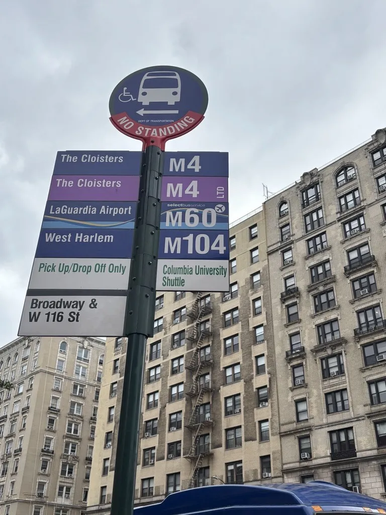 116 N stop at Broadway, showing the M4/M104 city bus lines and the Columbia Shuttle represented on sign at bus stop